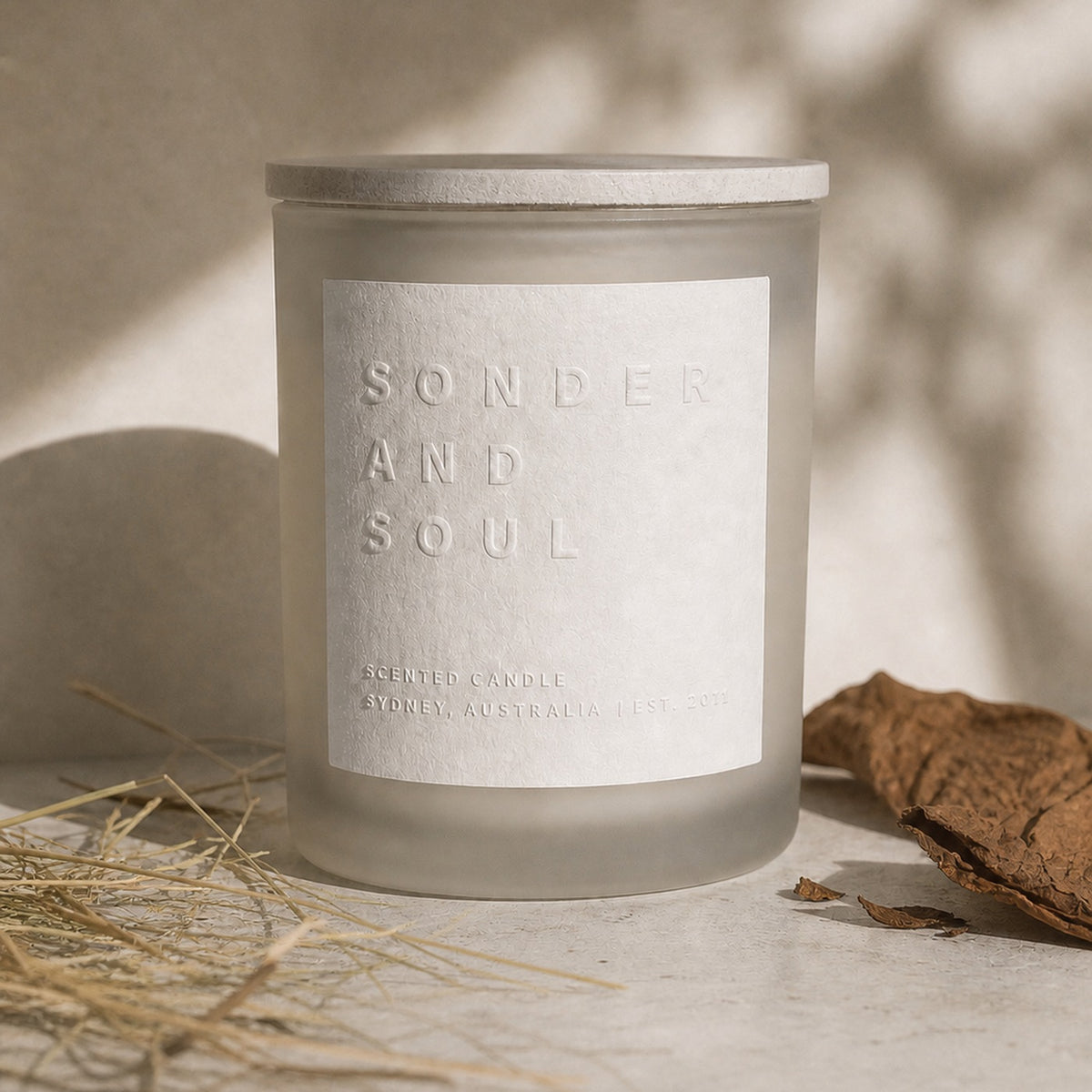 Dry Tobacco and Hay soy candle by Sonder and Soul, styled with the fragrance notes