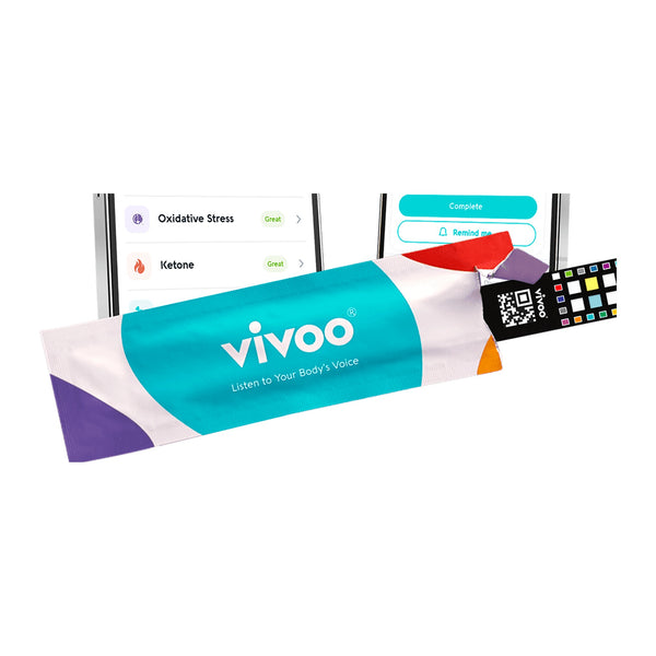 Vivoo at home urine test single strip sachet with the colour reference card and the app results screen