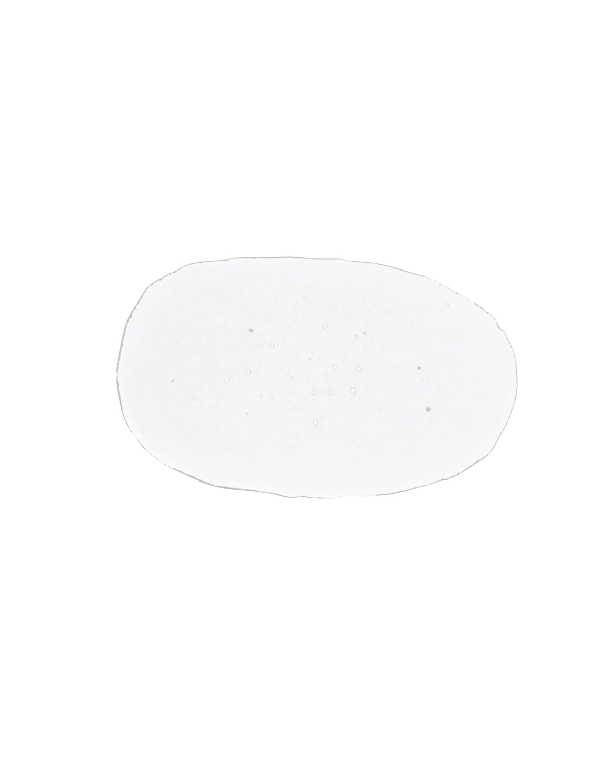 Clear circular drop of toner on a white background
